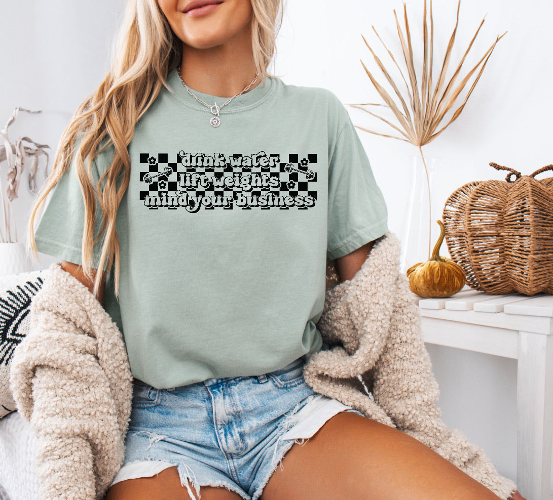 Checkered Drink Water, Lift Weights, Mind Your Business Shirt – Motivational & Comfortable Comfort Colors Tee for Fitness Lovers